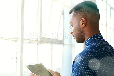 Buy stock photo Businessman, tablet and screen at window for communication, internet search and networking in office. Entrepreneur, african employee or serious with technology for corporate email or planning at work