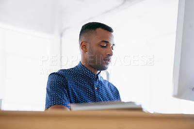 Buy stock photo Businessman, thinking and working in office by desk, planning and commitment with ambition in career. Entrepreneur, idea and typing on desktop on technology and project management in small business