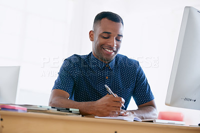 Buy stock photo Computer, research and man writing notes in office for creative project on internet by desk. Technology, smile and professional male designer working online with desktop in modern workplace.