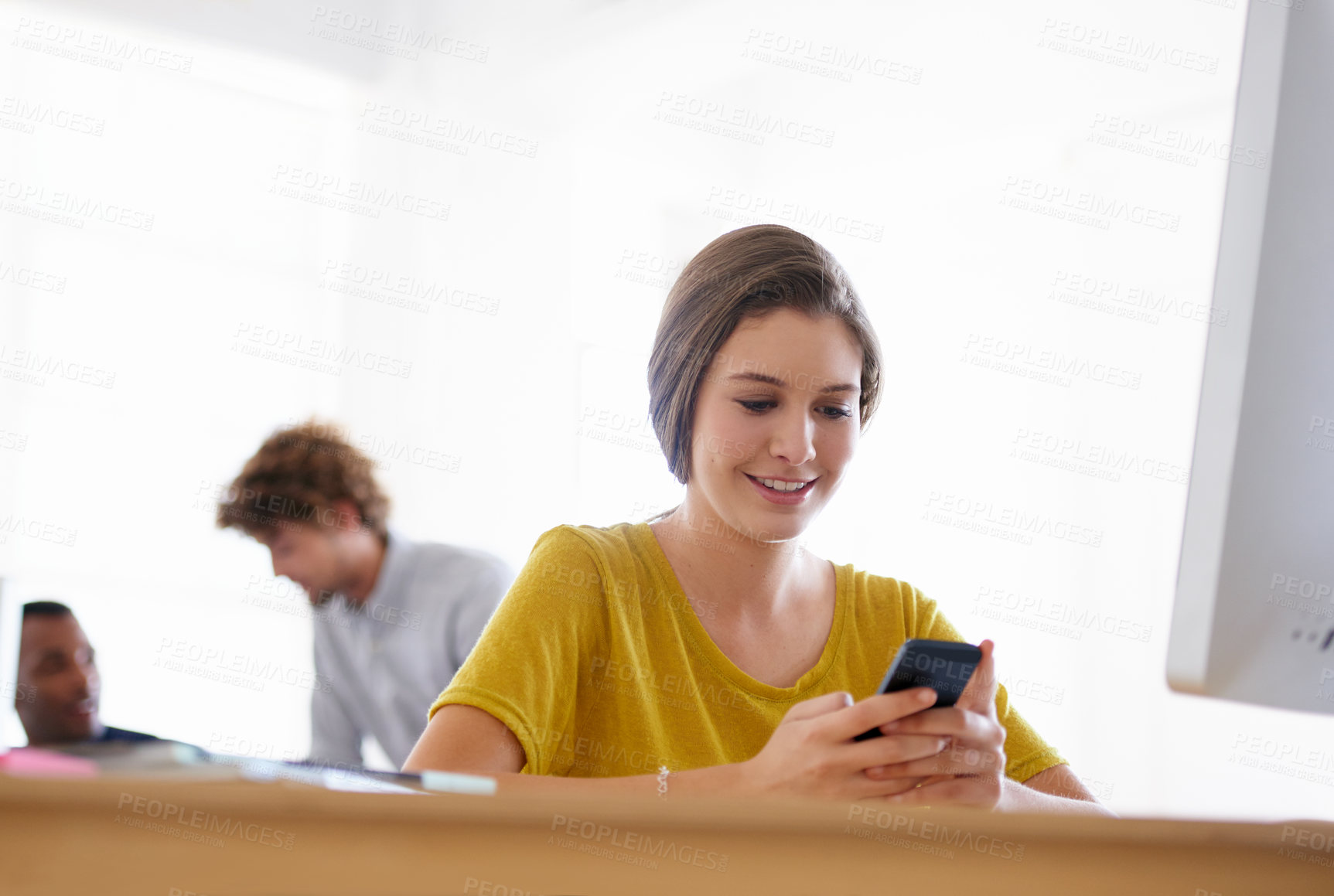 Buy stock photo Happy woman, phone and typing at office for social media, communication or networking by computer. Female person or creative employee on mobile smartphone for online chatting, texting or startup