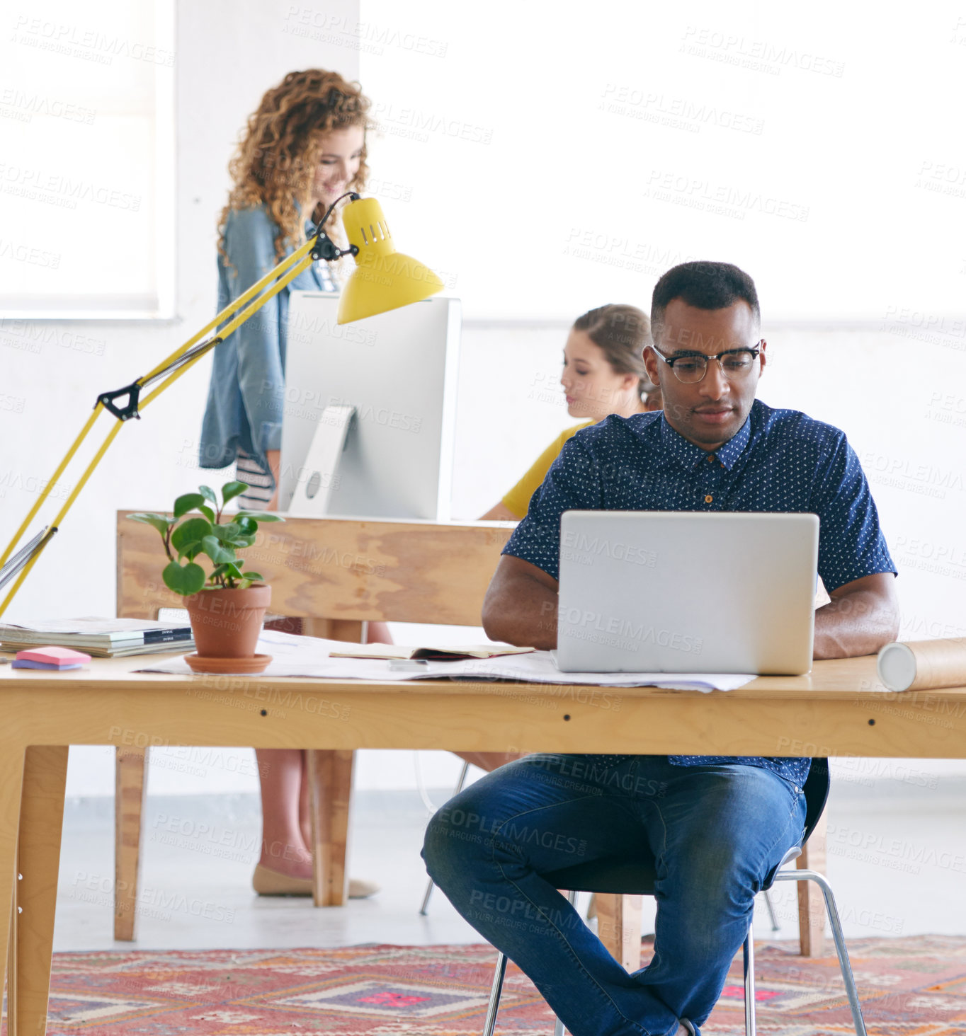 Buy stock photo Man, intern and typing on laptop in creative career, working and professional at new job. Male person, journalist and writer for newspaper, online publication and magazine with diversity at workplace