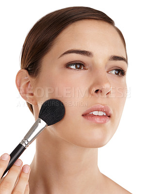 Buy stock photo Cropped shot of a beautiful young woman applying blusher against a white background