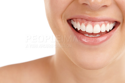 Buy stock photo Closeup shot of a young woman's toothy smile against a white background