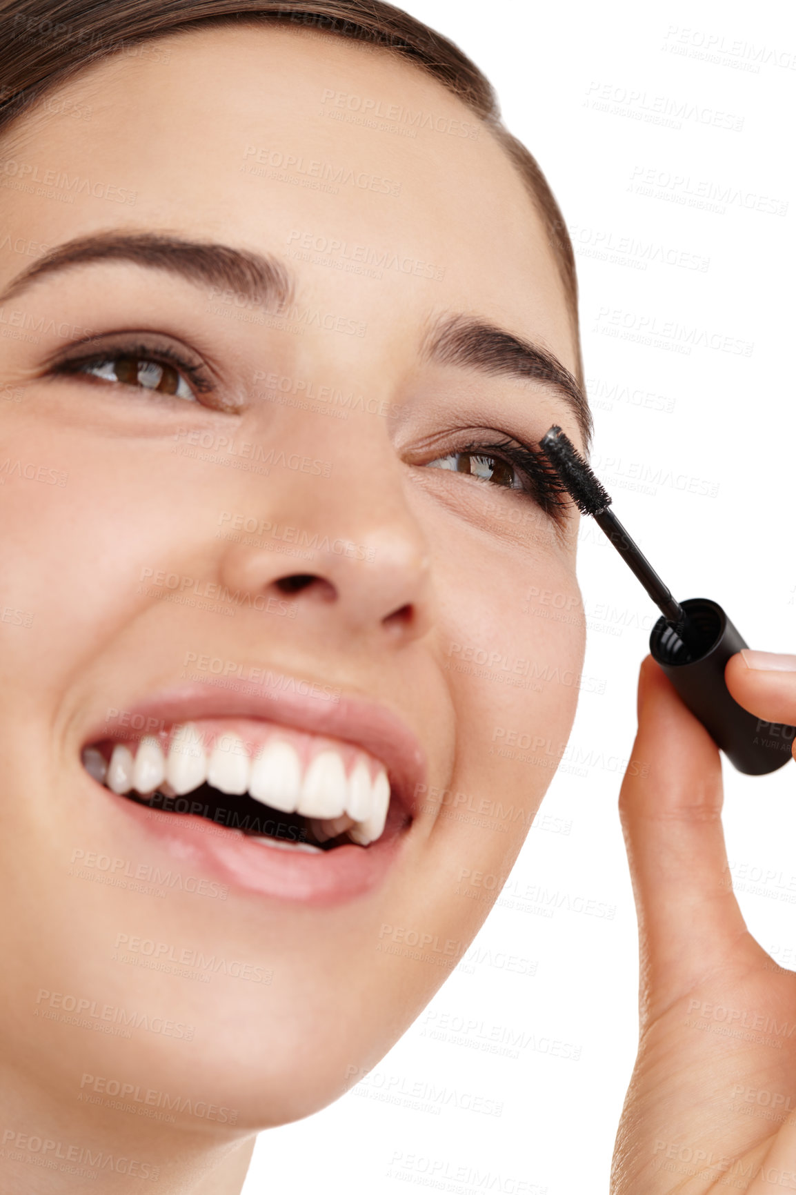 Buy stock photo Cropped shot of a beautiful young woman applying mascara against a white background