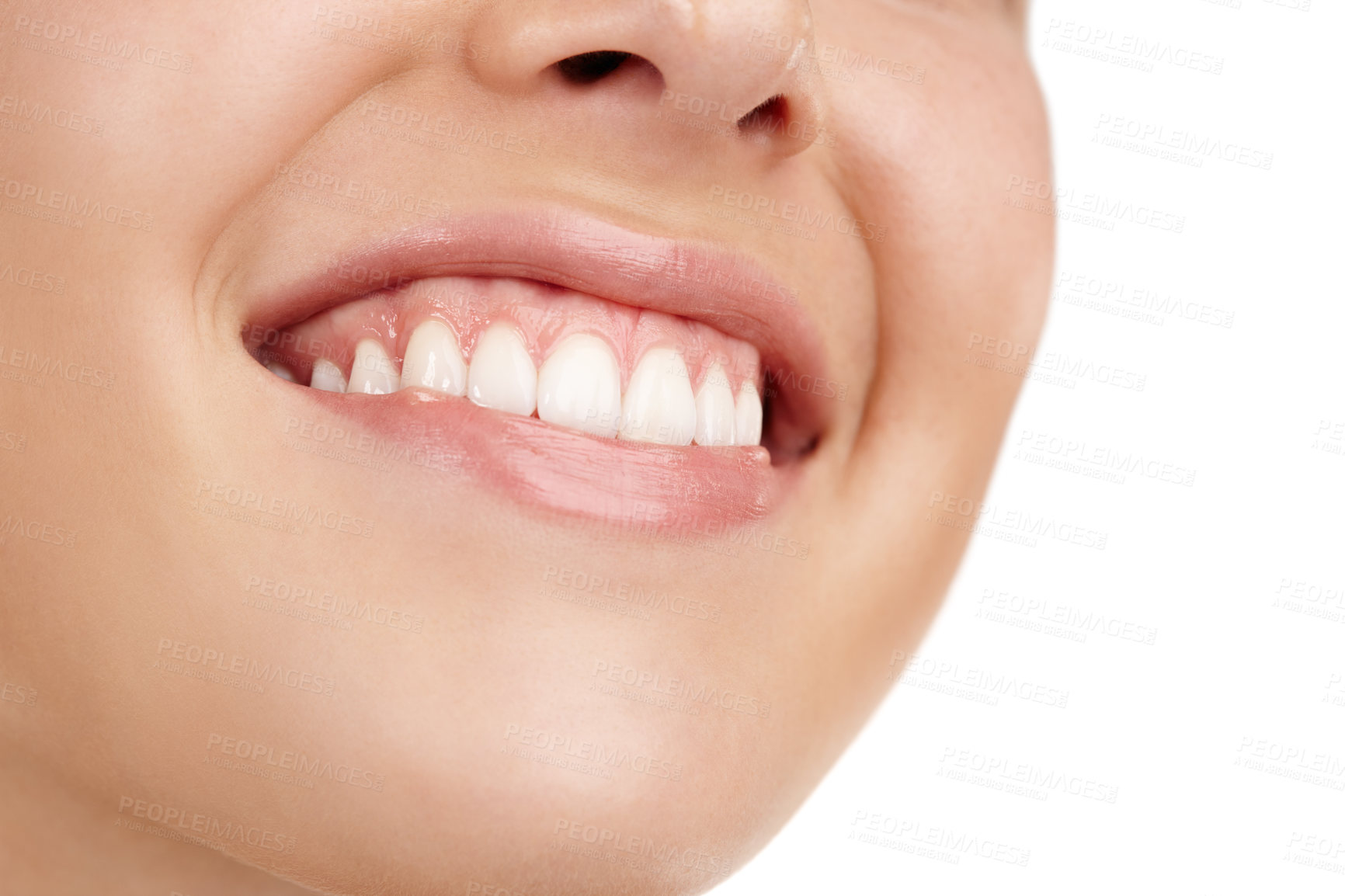 Buy stock photo Closeup shot of a young woman's toothy smile against a white background