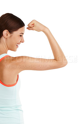 Buy stock photo Shot of a beautiful young woman flexing her muscles