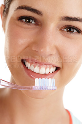 Buy stock photo Beautiful young lady holding toothbrush and smiling