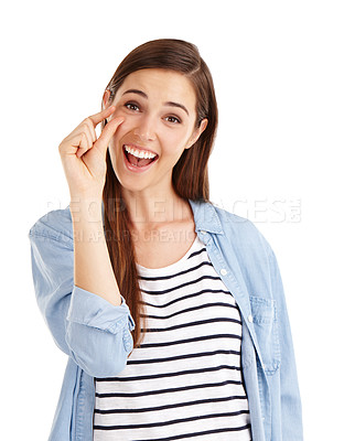 Buy stock photo Studio shot of a beautiful young woman indicating a small size with her hands against a white background 