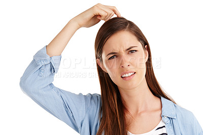 Buy stock photo Studio shot of a beautiful young woman scratching her head in confusion against a white background 