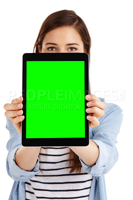 Buy stock photo A young woman holding a digital tablet with green screen copyspace