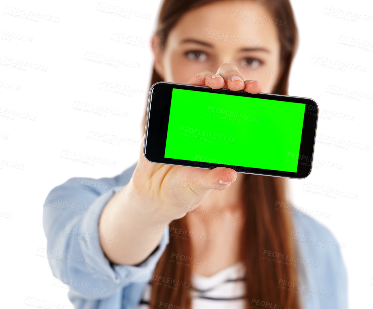 Buy stock photo A young woman holding a mobile phone with green screen copyspace