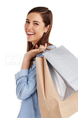 Buy stock photo Studio shot of a beautiful young woman holding shopping bags against a white background 