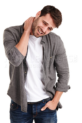 Buy stock photo Studio shot of a young man grimacing in pain while holding his neck