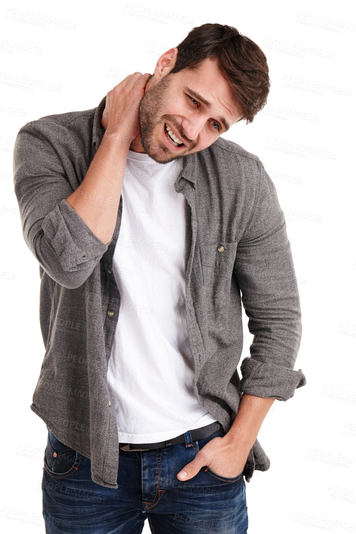 Buy stock photo Studio shot of a young man grimacing in pain while holding his neck