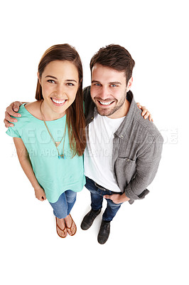 Buy stock photo High-angle portrait of a happy young couple posing against a white background