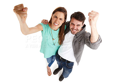 Buy stock photo High-angle shot of a young couple in a studio shaking their fists angrily at the camera