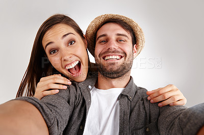 Buy stock photo Self portrait of a happy young couple in studio