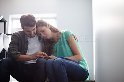 Buy stock photo Shot of a man comforting a distressed woman in a stairwell