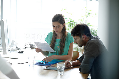 Buy stock photo Shot of young professionals working together in an office