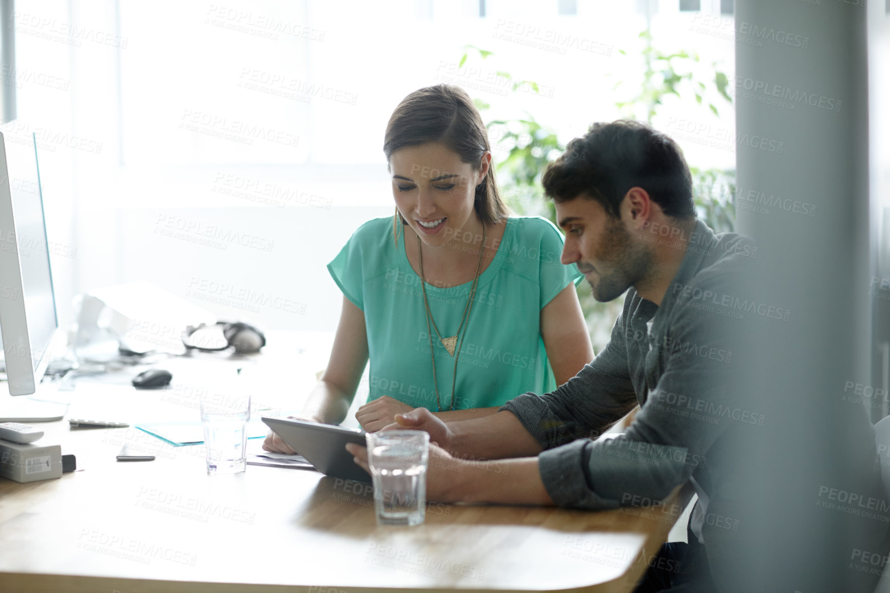 Buy stock photo Meeting, tablet and business people in office for planning, teamwork and collaboration. Startup, creative agency and man and woman on digital tech for feedback, project and research on website