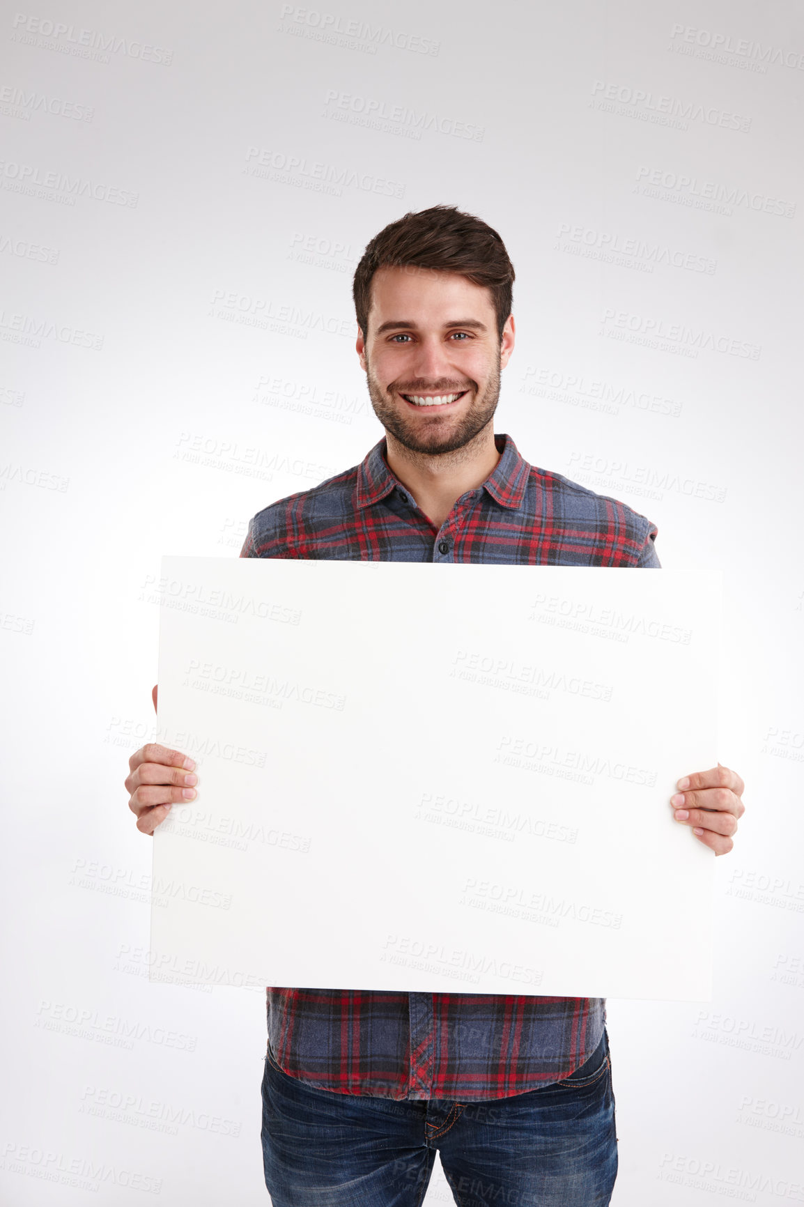 Buy stock photo Man, blank poster and copy space in studio portrait with smile for opinion, sign and review by white background. Person, model and happy for mock up, paper and board for announcement in New Zealand