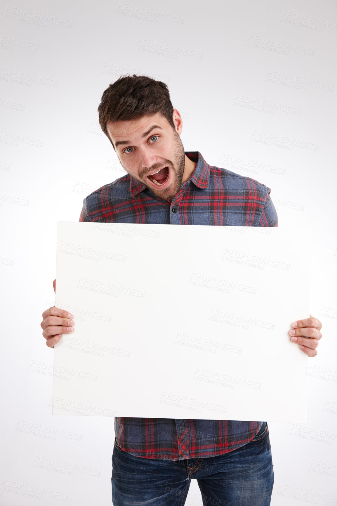 Buy stock photo Man, blank poster and surprise in studio portrait with opinion, sign and exited for review by white background. Person, space and happy for mock up, paper and board for announcement in New Zealand