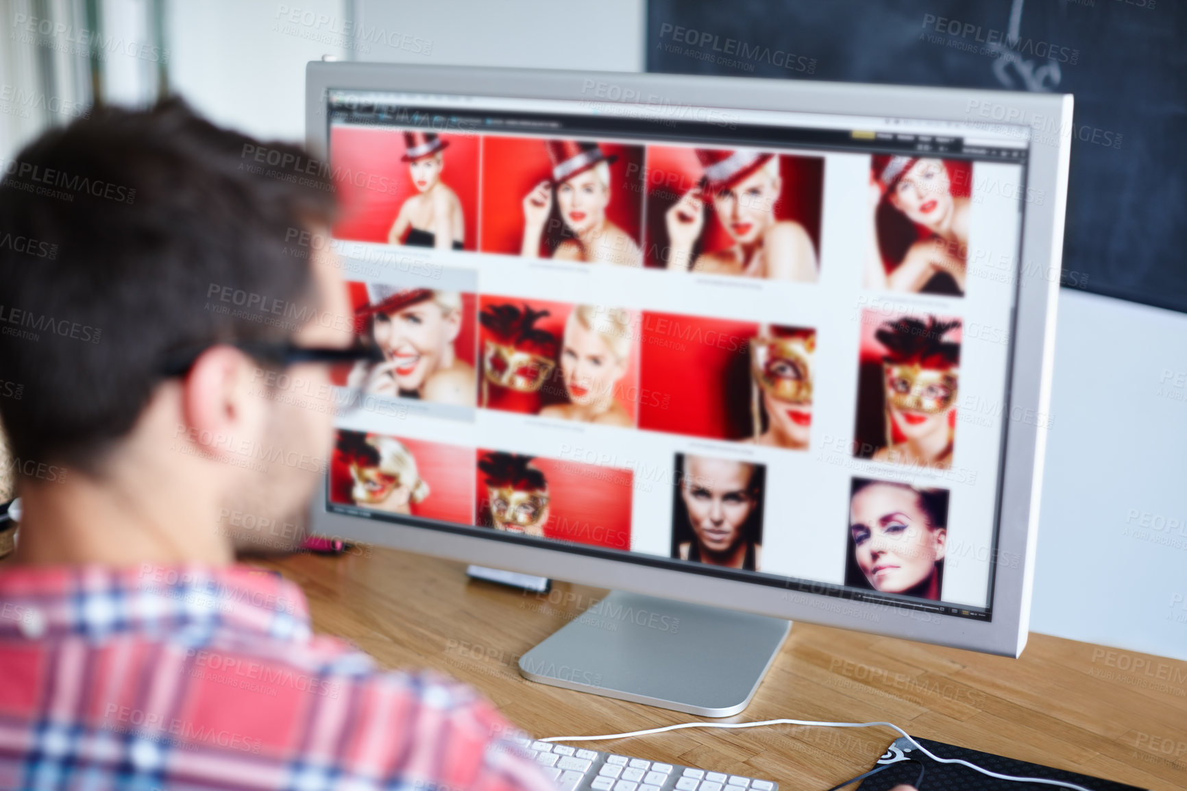 Buy stock photo Shot of a creative professional at his desk working at his computer