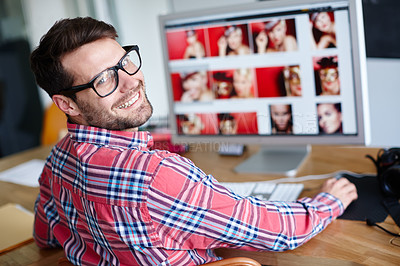 Buy stock photo Shot of a creative professional looking back over his shoulder at you