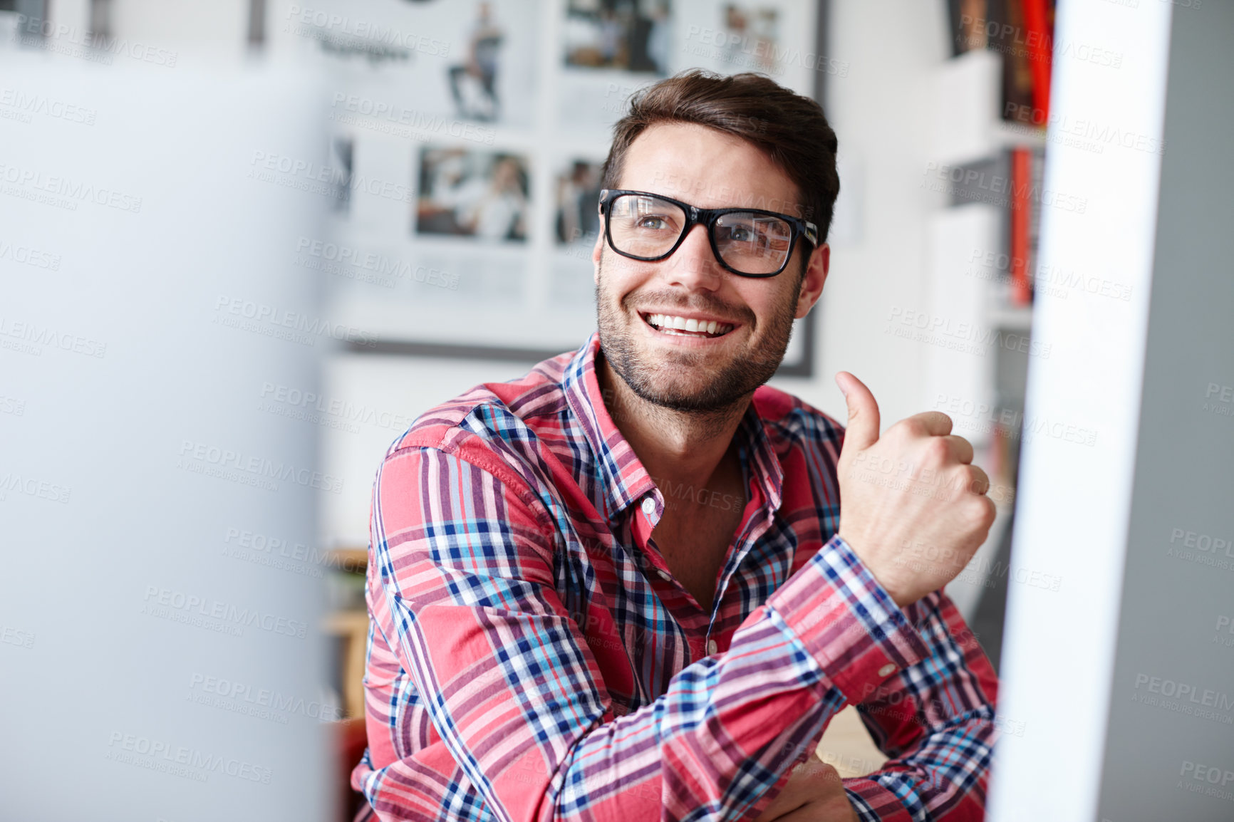 Buy stock photo Shot of a creative professional looking away while smiling positively