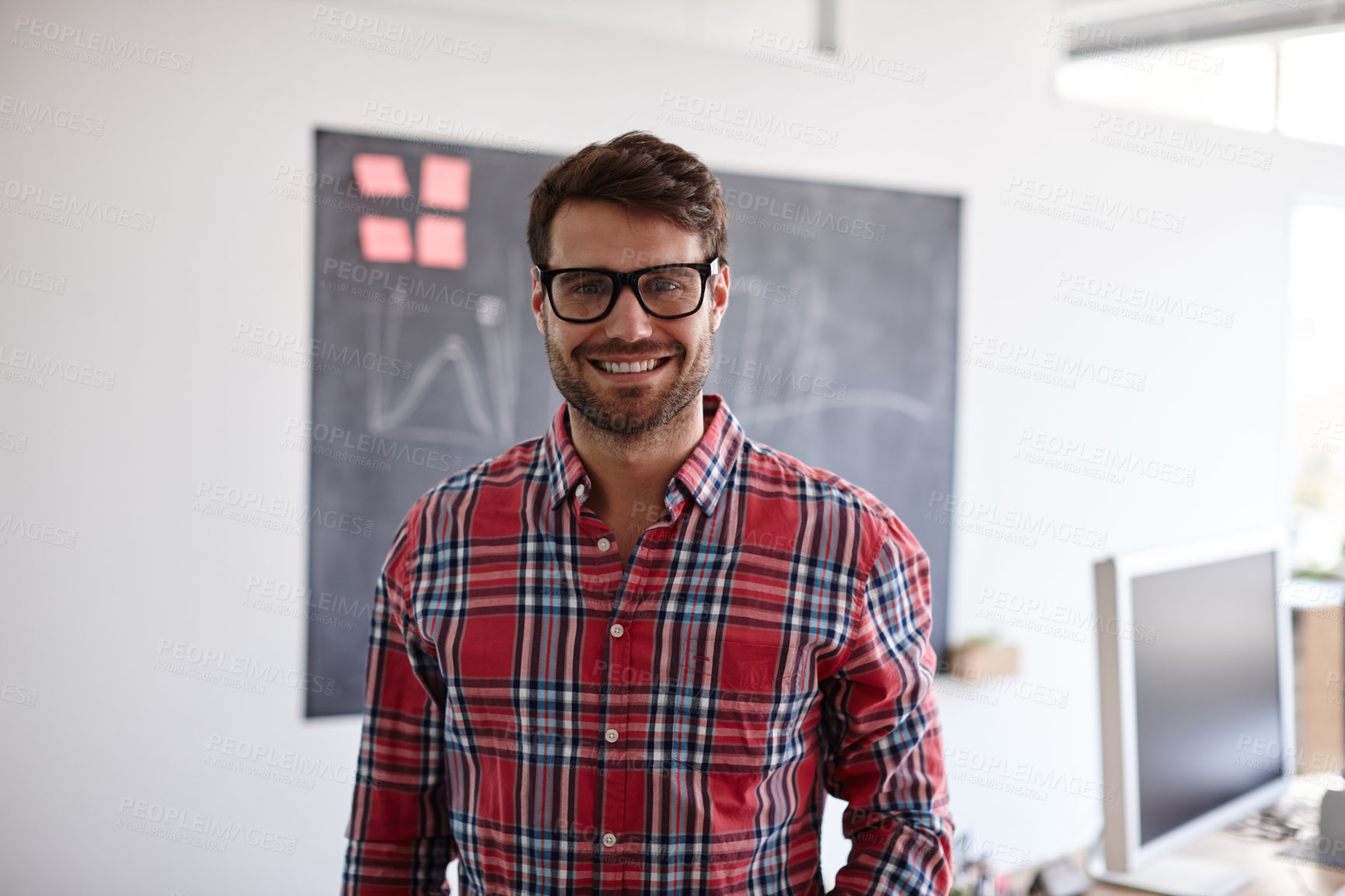 Buy stock photo Portrait shot of a handsome creative professional smiling confidently in his office