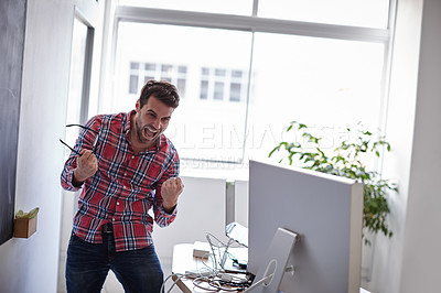 Buy stock photo Shot of  young designer in his office, screaming with rage