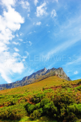 Buy stock photo Blue sky, clouds and mountain at countryside for environment, sustainability and summer growth. Nature, beauty and hill with grass in daylight for eco friendly, green earth and sunshine in Japan