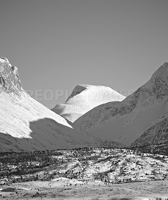 Buy stock photo View of snow capped mountains and the glacier North of the Arctic Polar Circle in black and white. Open and empty mountain hill tops against clear sky.  Monochrome of large mountains in Norway