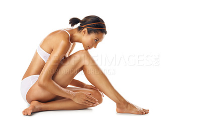 Buy stock photo Body care, hair removal and model in underwear in a studio with a wellness, skin care and natural routine. Cosmetic, epilation and female model with a smooth body treatment posing by white background