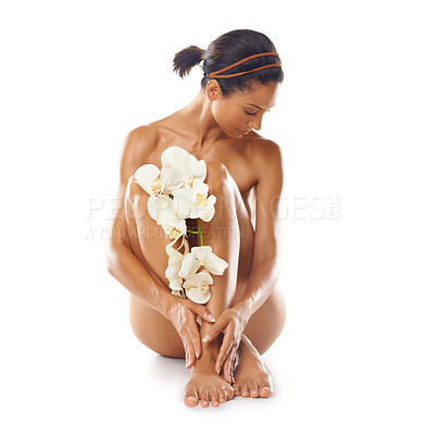 Buy stock photo Flowers, skincare and beauty of woman in studio on a white background mock up. Floral cosmetics, organic makeup and young female model with orchids on legs for skin treatment, body care and wellness.