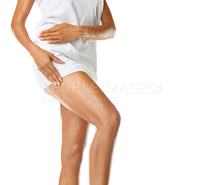 Buy stock photo Woman, legs and towel in studio for skincare, wellness and luxury beauty. Female leg, toweling and bathroom for hair removal, natural skincare and cleaning body with epilation, cosmetics and shine