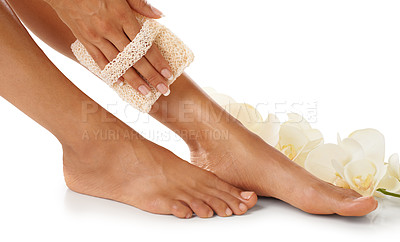 Buy stock photo Scrub, pedicure and woman feet in studio for spa, luxury and skincare with floral product advertising. Skin care, beauty and natural flowers for cosmetics foot isolated on white background marketing