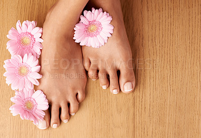 Buy stock photo Feet, spa and pedicure with flowers and skincare ready for wellness and floral foot massage. Black woman, luxury and skin care of a person with body, dermatology and cosmetic beauty health treatment