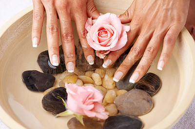 Buy stock photo Spa, manicure and hands of a woman with rose flower and luxury wellness. Water, beauty and skincare of a model hand with roses and flowers aromatherapy for cosmetic skin care and cleaning indoor