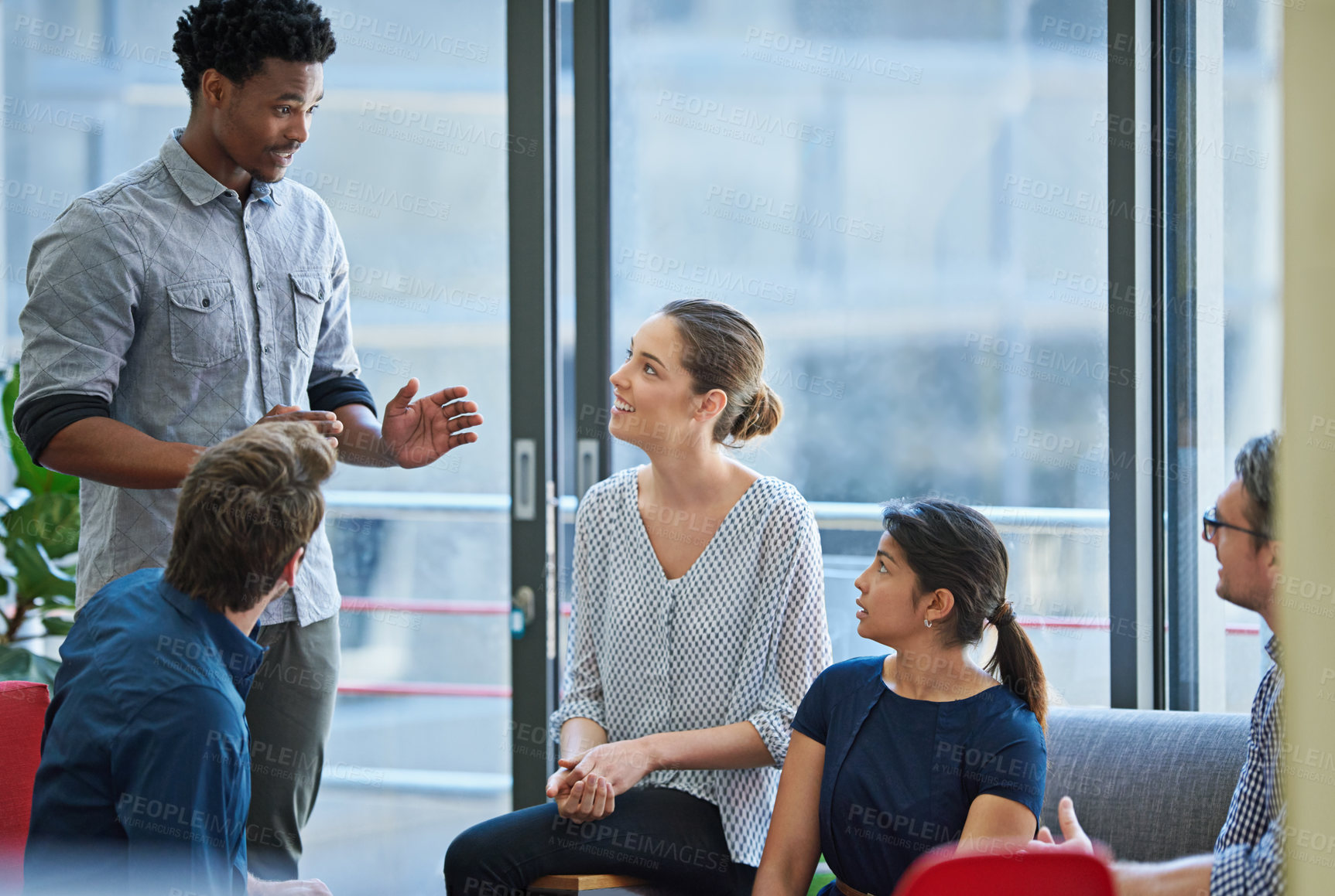 Buy stock photo Businessman, discussion and presentation with team in meeting for idea, proposal or training staff at office. Man, speaker or presenter talking to group of employees for company mission at workplace