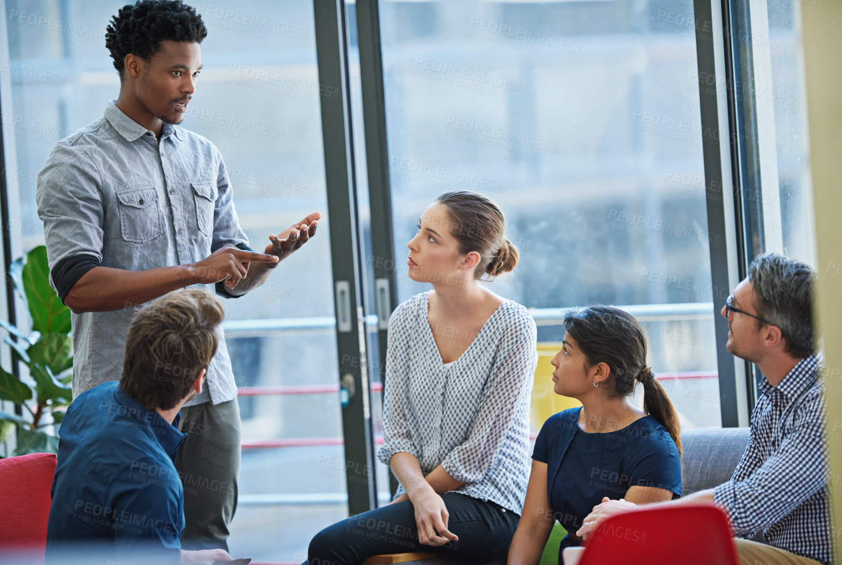 Buy stock photo Businessman, discussion and presentation with group in meeting for idea, proposal or training staff at office. Man, speaker or presenter talking to team or employees for company mission at workplace