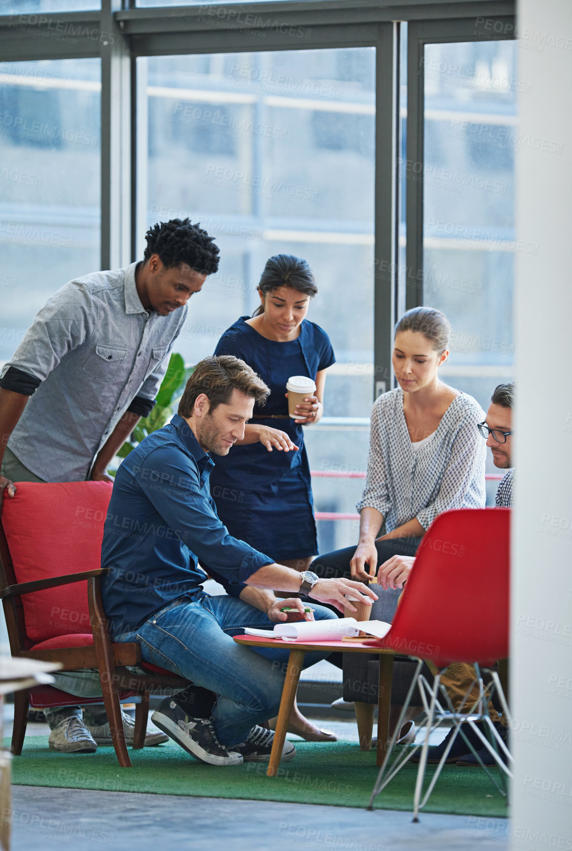 Buy stock photo Shot of a group of office workers talking together in a meeting room