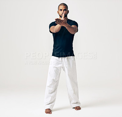 Buy stock photo Studio, portrait and man with karate for practice, training exercise and self defence in workout. Serious, male person and pose in martial arts for sports, fitness and health on white background