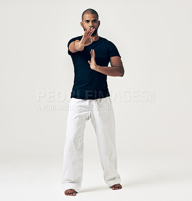 Buy stock photo Karate, master and portrait of fight in martial arts training or challenge with hands on white background. Studio, exercise and person with skill in self defence technique or practice creative action