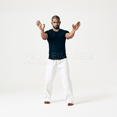 Buy stock photo Studio, portrait and man in exercise of karate, martial arts training or gesture with hands on white background. Calm, fighter and person with skill in self defence technique or practice action