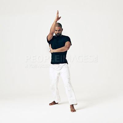 Buy stock photo Karate, training and portrait of man in martial arts exercise or challenge with hands on white background. Studio, gym and person with skill in self defence technique or practice action of fight