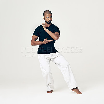 Buy stock photo Tai chi, training and man in martial arts exercise or calm movement with hands on white background. Balance, workout and person with skill in self defence technique or healthy practice of action