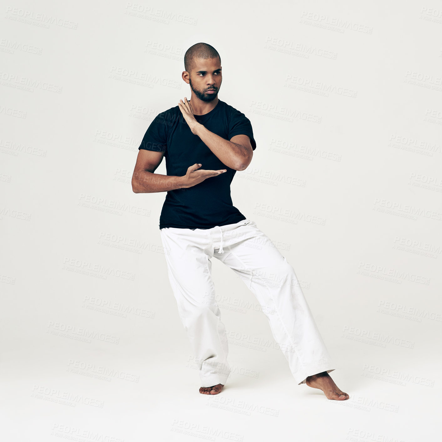 Buy stock photo Tai chi, training and man in martial arts exercise or calm movement with hands on white background. Balance, workout and person with skill in self defence technique or healthy practice of action
