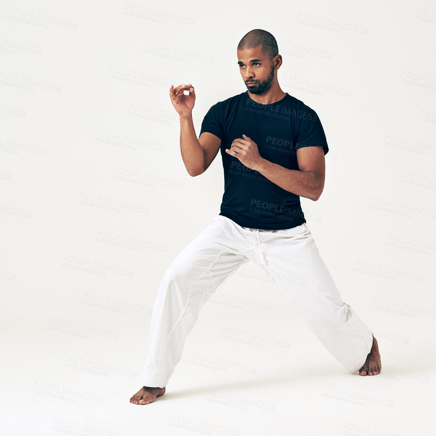 Buy stock photo Man, studio and ready for attack on martial arts, action and karate exercise on white background. Black male person, mockup space and training for combat, fight and position of fitness in taekwondo
