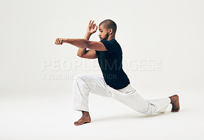 Buy stock photo Man, studio and martial arts for attack position, action and karate exercise on white background. Black male person, mockup space and training for combat, fight and fitness for punch or workout